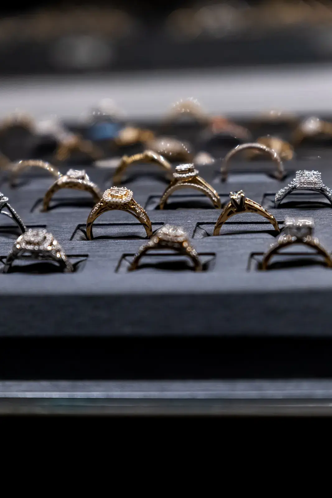 Halo engagement rings in yellow and white gold