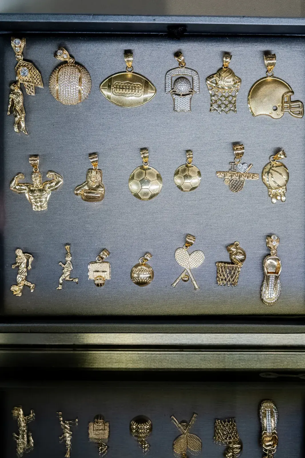 Gold sports charms and pendants