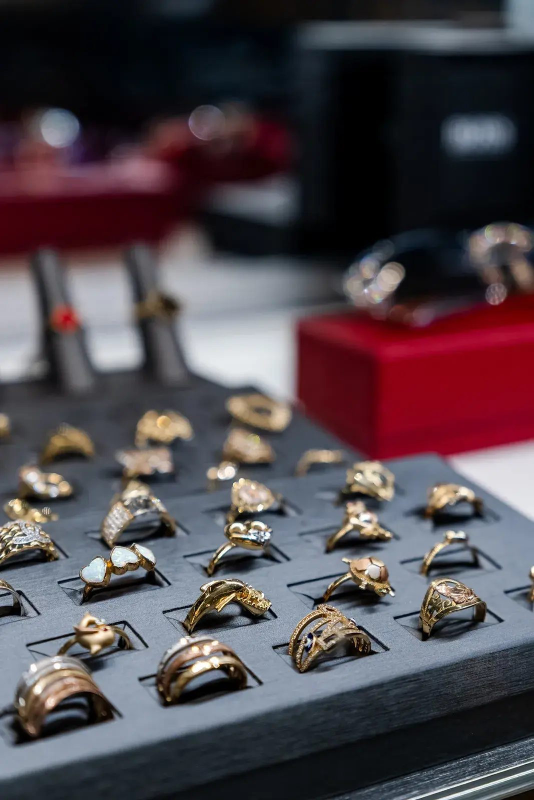 Ladies' gold rings with opals and gemstones